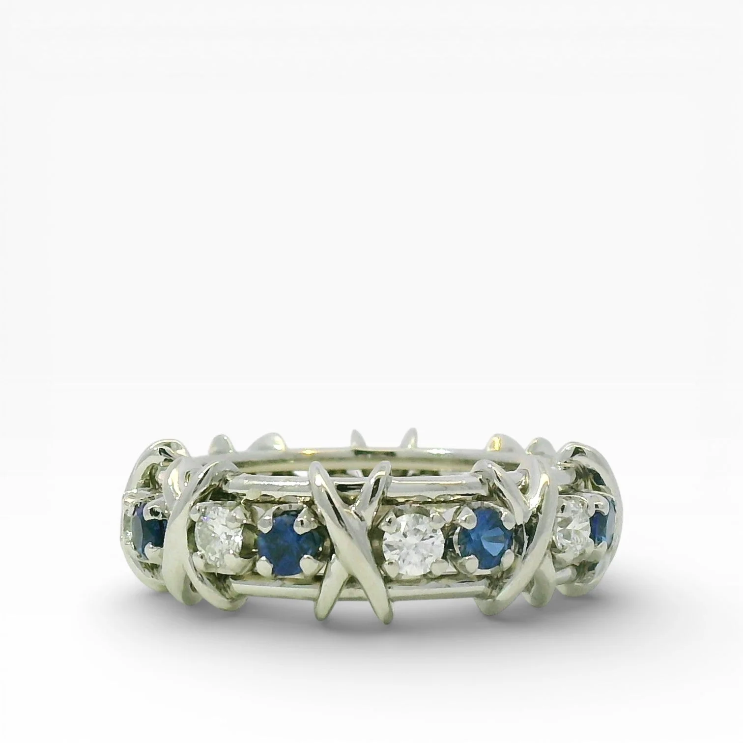 Tiffany & Co. Estate Jean Schlumberger Platinum, Diamond & Sapphire Sixteen Stone Ring